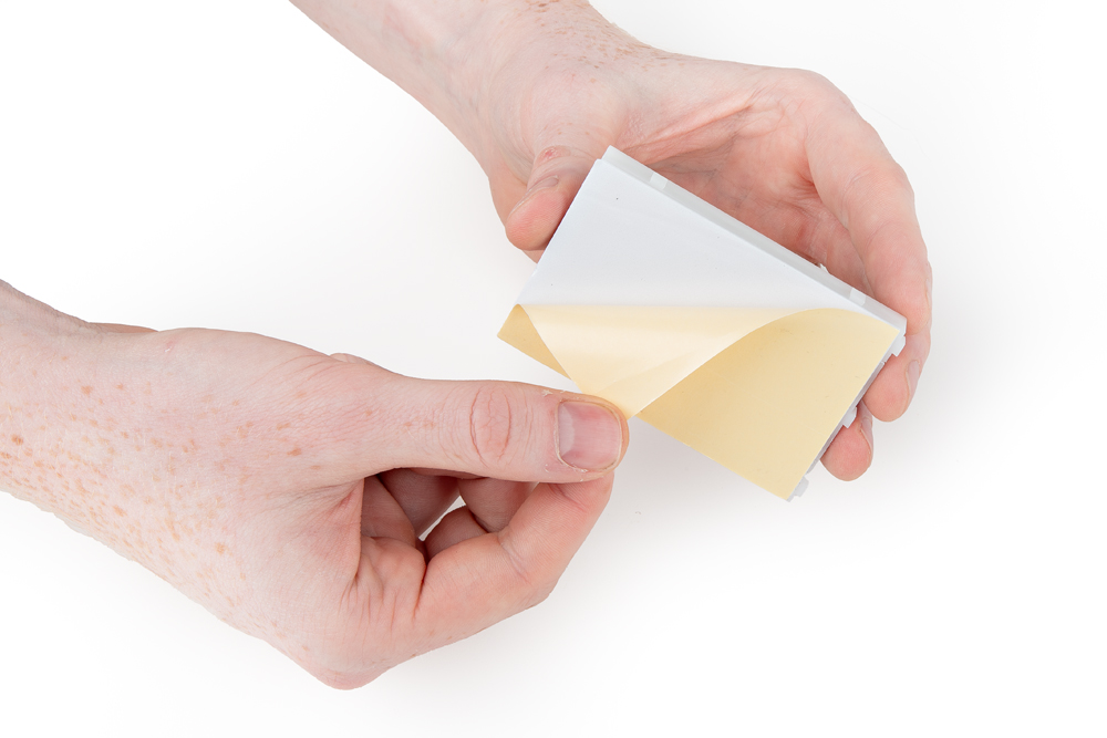 Peel adhesive and align the breadboard on the baseplate